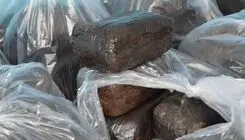 ۵۰ کیلوگرم تریاک در خمیر کشف و ۲ سوداگر مرگ دستگیر شدند